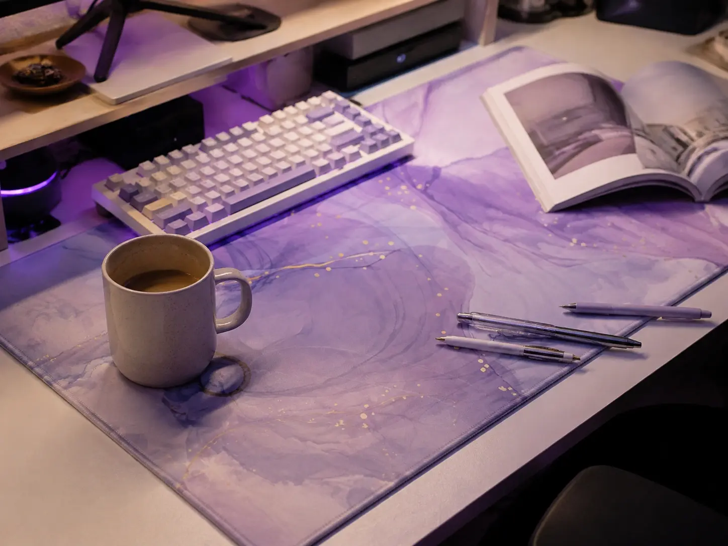 Smooth pastel lavender PU leather desk mat on a white desk