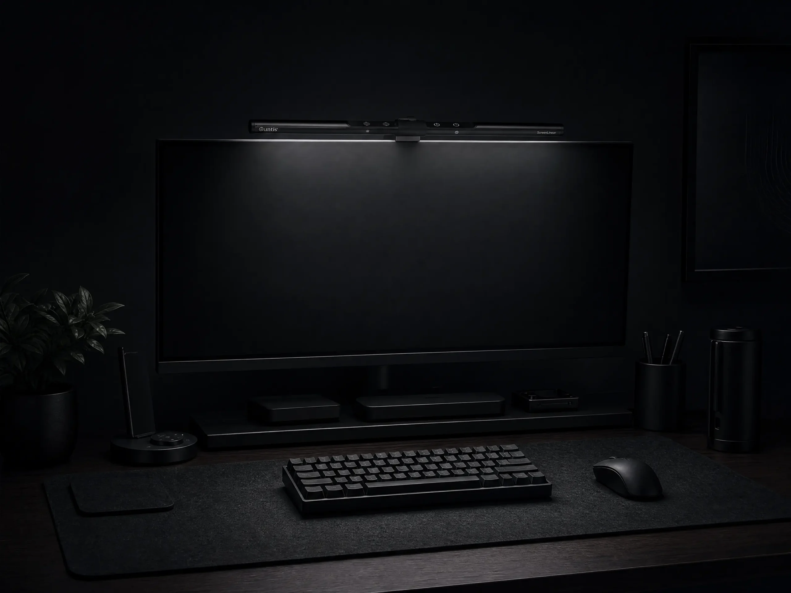 Minimalist black monitor light bar for dark workspace