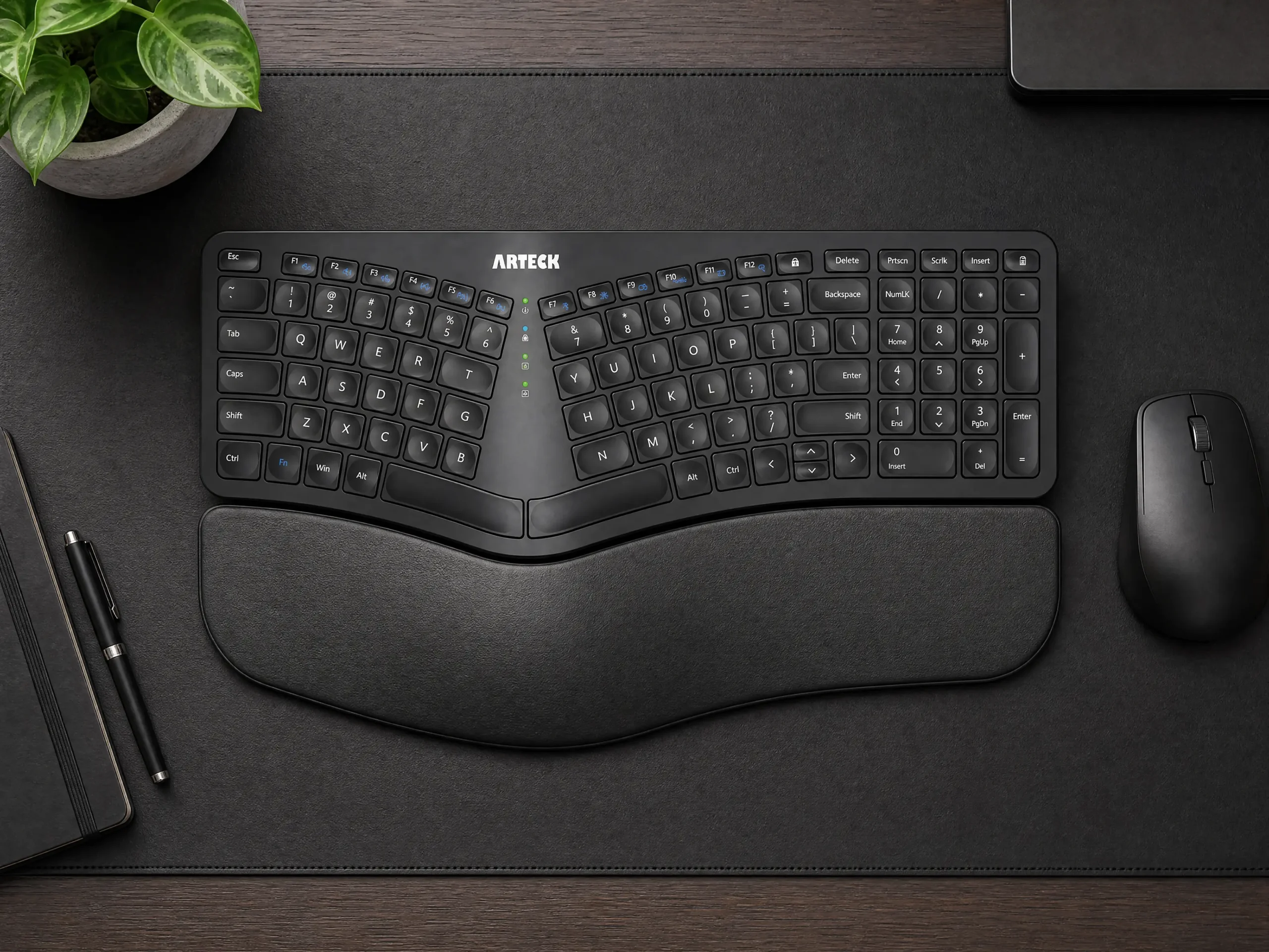 Sleek split ergonomic mechanical keyboard on dark desk mat