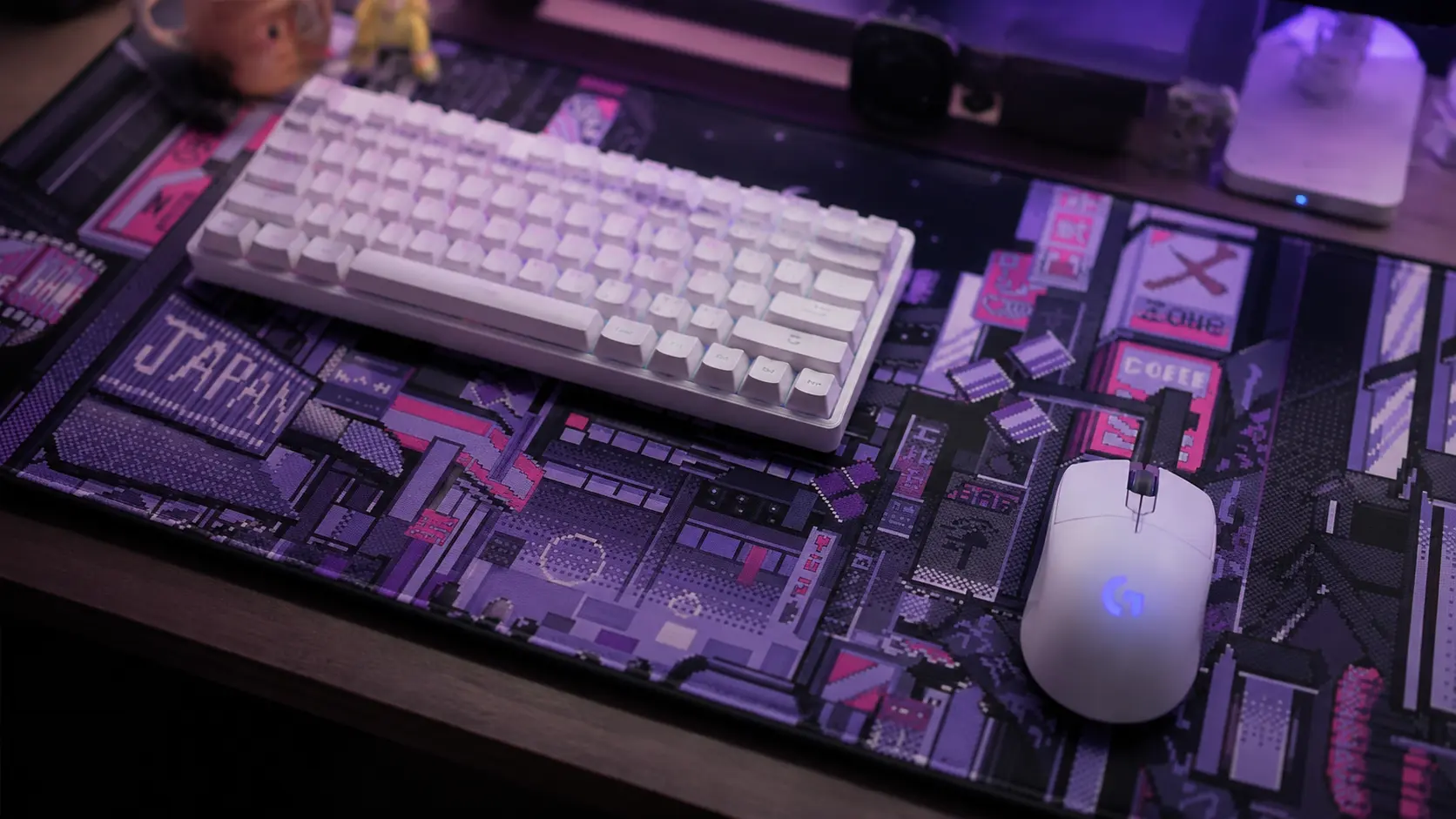 Close up of a Japanese anime themed extended desk mat with gaming keyboard