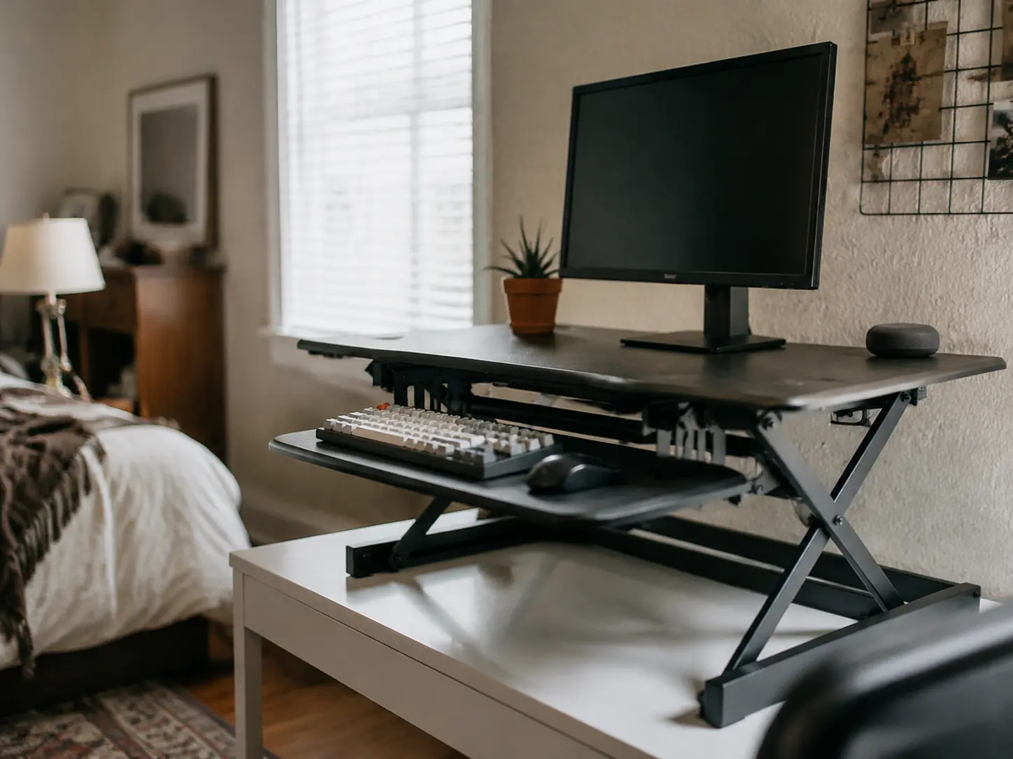 Compact standing desk converter on white work table