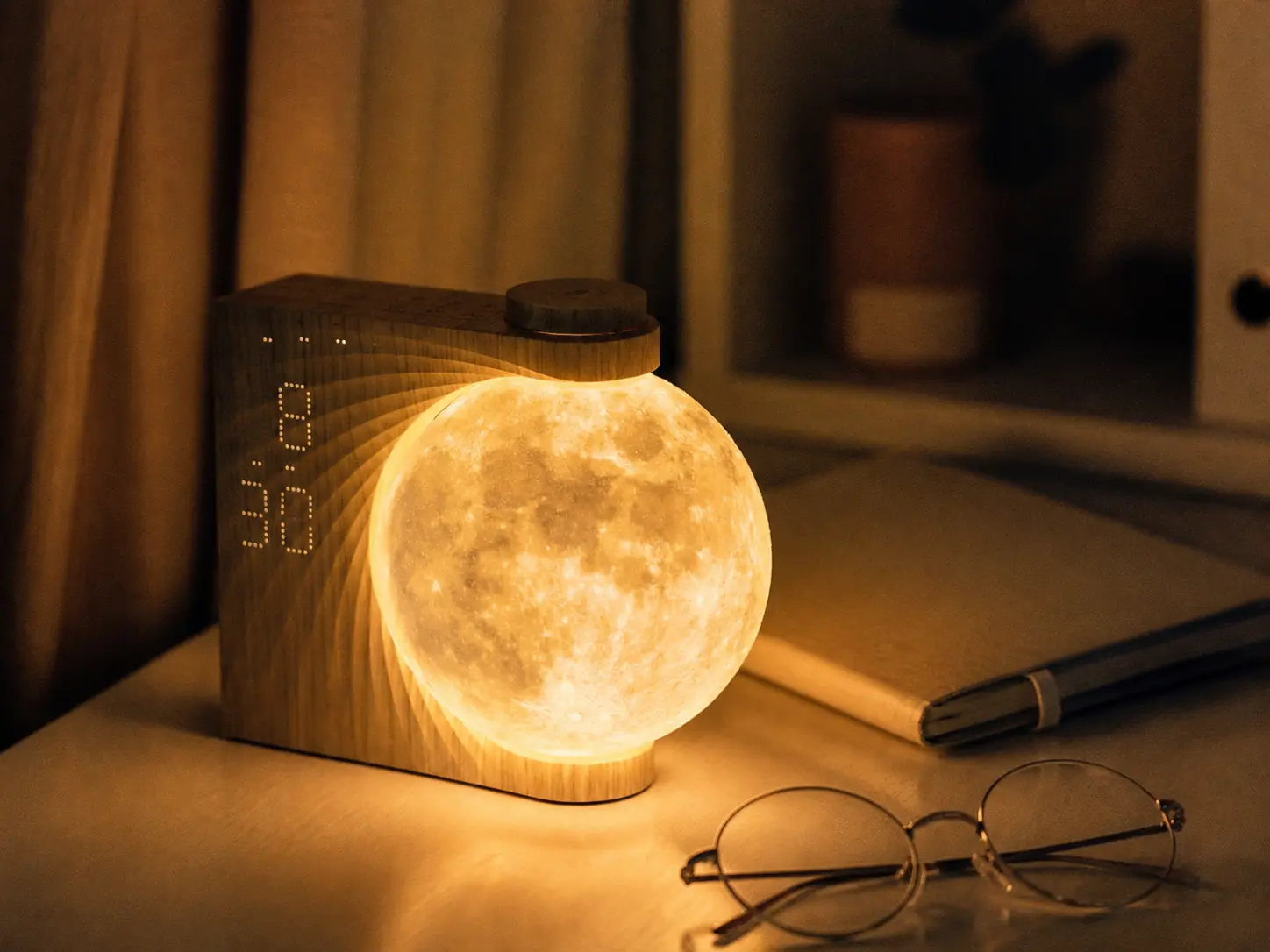 Minimalist wooden LED digital clock on a tidy desk